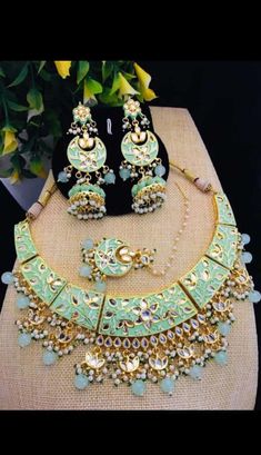 Occasion might be any, getting ready In a Sophisticated Manner Is Women'S Thing that they enjoy the most Mint Green Jadau Necklace Earrings Tika Set, Indian Kundan Jewelry Set, Statement Necklace Earrings Minakari Set, Bridal Necklace Earrings ITEM DESCRIPTION Metal = Gold Plated Occasion = Wedding ,Party Wear, Bridal Color = Green and White Size = Necklace Length = 8 Inches, Earrings/Studs Size = 3 Inches, Tika - 5 Inches 100% Satisfaction Guarantee: 1 Year Warranty, Long Lasting Plating, High- Green Dangle Jewelry For Diwali, Green Meenakari Dangle Jewelry, Green Dangle Bollywood Style Jewelry, Green Bollywood Style Dangle Jewelry, Round Green Meenakari Jewelry Set, Green Meenakari Jewelry Set, Green Meenakari Fusion Jewelry, Green Fusion Meenakari Jewelry, Green Jewelry With Matching Earrings For Festivals