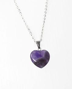 "Genuine Amethyst Gemstone Heart Necklace. Beautiful natural Amethyst heart necklace, choice of chain length. Heart pendant measures approximately 20mm. ☆ Amethyst ☆ The birthstone for February, represents health, luck and humour. ♥ Encourages self-control. ♥ Brings stability. ♥ Calms harsh emotions. ♥ Aids meditation and sleep. ♥ Maintains equilibrium. To see our full range of jewellery please click here: https://www.etsy.com/uk/shop/WishKnotsJewellery  ☆ Chain Options ☆ ♡ Silver Plated Chain - Heart-shaped Amethyst For Jewelry Making, Heart Shaped Amethyst For Jewelry Making, Valentine's Day Amethyst Heart Necklace, Amethyst Heart Charm Pendant Necklace, Amethyst Heart Pendant Necklace, Heart-shaped Gemstone Healing Necklace, Heart-shaped Amethyst Necklaces As Gifts, Heart-shaped Gemstone Necklace For Healing, Heart-shaped Amethyst Necklace For Gifts