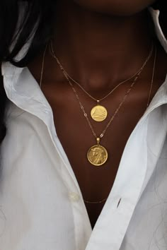 THE PYRAMID Coin Necklace is handcrafted based on an authentic Egyptian coin with precious metals using the traditional lost-wax casting technique. The design features the Pyramids of Giza, the oldest and only surviving wonders of the ancient world. The pyramids are intricately aligned to the north-south, east-west poles and the belts of the constellation of Orion. Metal Info & CareAvailable in:Sterling Silver, 18K Gold Vermeil (18K Gold over Sterling Silver), Solid 10K, 14K, 18K, & 24K African Gold, Solid Gold Chains, Lost Wax Casting, Gold Necklace Women, Coin Necklace, Coin Pendant, Accessories Jewelry, Cute Jewelry, Pyramid