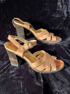 Vintage 1970s stacked heel strappy leather sandals high heels. Normal wear for their age women's size 7 Vintage Sandals With Block Heel For Spring, Vintage Block Heel Sandals For Spring, Vintage Open Toe Sandals With Buckle, Vintage Open Toe Sandals With Buckle Closure, Retro Open Toe Heels With Buckle Closure, Retro Heels With Ankle Strap And Heel Loop, Vintage Leather Sandals With Round Toe, Vintage Summer Heels With Block Heel, Vintage Block Heel Heels For Summer