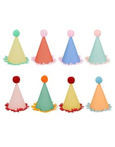 six party hats with pom poms on them