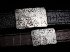 The Mesa Scroll buckle features Scroll engraving and its size nicely accents the hand-etched, heavy gauge sterling’s stark look. Bold, classic, and quietly confident, this is a quintessential Western-heritage piece. Has stationary bale. This piece comes in 3 different sizes. Smallest - Measures approx. 1 9/16" x 2 1/4" and fits a 1.25" belt strap Medium - Measures approx. 1 3/4" x 2 1/2" and fits a 1.5" belt strap Largest - Measures approx. 3 1/8” x 2" and fits a 1.5" belt strap *If you do not w Scroll Engraving, Alligator Belt, Ostrich Legs, Black Alligator, Floral Overlay, Notes Style, Silver Belt Buckle, Silver Belt, Silver Belts