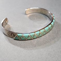 Vintage Sterling Silver Cuff Bracelet with Light Turquoise Blue Inlay, Beautiful Birthday Gift 925 Silver Jewelry for Her ► FEATURES * 2.5 inches wide inner dimension, fits an average woman's wrist. * Stamped "925" on the inside * Southwestern tribal style  * 8mm wide  This vintage bracelet is from around 2000 or earlier. It's in great condition. It may have some antiqued and tarnishing. It's been in storage all of these years. I'll give it a light polish before shipping. Message me if you have Adjustable Blue Cuff Bracelet For Anniversary, Turquoise Sterling Silver Bracelets For Anniversary, Turquoise Sterling Silver Bracelet For Anniversary, Southwestern Style Turquoise Bangle As A Gift, Southwestern Sterling Silver Cuff Bracelet In Blue, Southwestern Blue Sterling Silver Bracelet As A Gift, Blue Southwestern Sterling Silver Bracelet Gift, Adjustable Blue Cuff Bracelet Stamped 925, Southwestern Blue Sterling Silver Bangle Bracelet