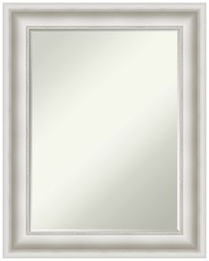 a white framed mirror with an ornate border around the edges and bottom edge, on a white background