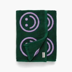 a green towel with purple circles on it