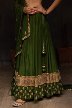 Leaf green silk lehenga in floral gota work. Paired with embroidered choli and dupatta.
Component: 3
Pattern: Hand embroidered
Type Of Work: Gota work, Sequins, Bead work
Neckline: V neck
Sleeve Type: Short sleeves
Fabric: Silk, Georgette
Color: Green
Other Details: 
Embroidered dupatta
Side tie up lehenga
Occasion: Mehendi, Haldi - Aza Fashions Gota Work, Embroidered Dupatta, Leaf Green, Silk Lehenga, Fabric Silk, Green Silk, Bridal Lehenga, Set For Women, Aza Fashion