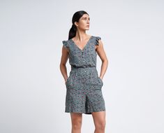 "A lightweight short summer romper feturing v-neckline, short ruffled sleeves and a shift silhouette. - V neck - short ruffled sleeves - shift silhouette - front button closure - two pockets in side seams - fabric belt - mini length (above the knee) - flower print Fiber: 100 % viscose Color: dark green For Size S (06 US): length - 34\" (87 cm) You may feel free choosing the size. Just send us your measurements (bust, waist, hips, height)." Summer Floral Print Relaxed Fit Jumpsuits And Rompers, Casual Printed Jumpsuits And Rompers For Spring, Casual Floral Print V-neck Jumpsuits And Rompers, Summer Floral Print Overall Jumpsuits And Rompers, Spring Floral Print Overall Jumpsuits And Rompers, Summer Floral Print Jumpsuits And Rompers, Printed Overall Jumpsuits And Rompers For Summer, Printed Summer Overalls And Jumpsuits, Printed Jumpsuits And Rompers For Summer