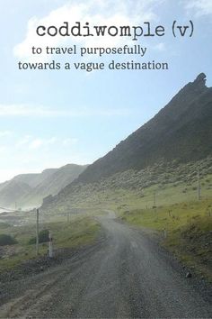 an image of a dirt road with the words goddwomple v to travel purposefully towards a vaque destination