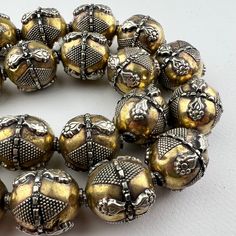 One handmade Kazakh style turkoman silver bead on brass. No two are exactly alike - hand fabricated. Lightweight gorgeous bead made in a very old tradition for an ethnic tribal look. So lightweight, we love the bigger bold look without the heavy weight.  One bead 25x19 approximately 3.5mm hole. Bronze Brass Jewelry With Large Beads, Traditional Handmade Beads For Jewelry Making, Artisan Handmade Beads For Festive Occasions, Antique Gold Polished Beads, Antique Polished Gold Beads, Antique Large Gold Beads, Artisan Handmade Festive Beads, Traditional Silver Beads For Festivals, Traditional Bronze Jewelry With Antique Finish