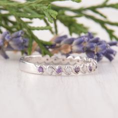 Amethyst Ring, Delicate ring, Eternity Ring, Wedding Band Silver, Unique Wedding Band, Dainty Wedding Band WE OFFER UNLIMITED PERIOD INSTALLMENTS PLAN This is a beautiful, stunning, feminine ring that works well for all occasions, styles, and ages. You will love it! Ring information: Stones: Amethyst Approximate size: 1.5mm (9 stones) Stones: White cubic zirconia Approximate size: 1.5mm (9 stones) Metal type: Silver Metal stamp: 925 Sterling Silver Installment Payments We offer installment payme Half Eternity Crystal Ring For Anniversary, Wedding Stackable Rings With Accent Stones, Wedding Stackable Rings With Round Cut Accent Stones, Stackable Wedding Rings In White Gold With Accent Stones, White Gold Stackable Wedding Rings With Accent Stones, Silver Diamond Wedding Ring With Birthstone, Bezel Set Diamond Ring With Round Band For Wedding, Wedding Diamond Ring With Bezel Setting, White Gold Wedding Ring With Birthstone