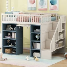 a child's bedroom with a loft bed and stairs