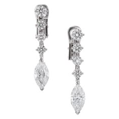 Round and marquise diamond dangle drop earrings in 18k white gold. EGL Certified 2 marquise cut diamonds F-G SI I, approx. 2.20tcw EGL Certificate #US400132122D 8 round brilliant cut diamonds G VS-SI, approx. .90cts 18k white gold Stamped: 18k 5.4 grams Top to bottom: 30.0mm 1 3/16 Inch Width: 5.15mm or 3/16 Inch Depth or thickness: 3.6mm Jewelry Earings, Gold Jewelry Aesthetic, Marquise Earrings, Black Dinner, Eye Makeup Pictures, 401k, Be Quiet, Jewelry Aesthetic, Accessory Jewelry