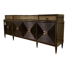 an art deco sideboard with three drawers and geometric design on the front, in dark wood