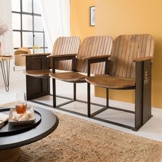 three wooden chairs sitting next to each other on top of a rug in front of a window