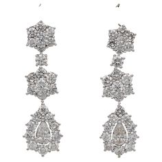 Dazzling Diamonds Exceptional quality mid century Diamond drop earrings composed by an high selection of round brilliant cut Diamonds of highest quality Designed as floret composition leading to the the main drop set with a pear cut diamond at the centre point in a frame of Diamonds beautiful designed, simple and effective, so eye catching and full of marvelous Diamond Sparkle The two pear cut Diamonds are .90 Ct TCW with 50 in number brilliant cut Diamonds for 4.0 Ct – Diamond TCW is 4.90 CT Ra Luxury Diamond Drop Danglers, Exquisite Diamond Cut Drop Earrings, Luxury Diamond Cut Drop Earrings, Luxury Long Drop Diamond Earrings With Diamond Accents, 1st Dibs Earring, Luxury Vintage Drop Diamond Earrings, Vvs Diamond, Pear Cut Diamond, Diamond Drop Earrings