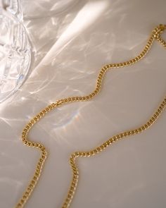 Make a statement with the Tribeca Curb Chain Choker! Perfect for layering and creating unique looks, this choker will provide a subtle but bold look. Express yourself and show off your style with the Tribeca Curb Chain Choker! NECKLACE FEATURES Material: Brass, 16K Gold Filled Chain Dimension: 3X2.2mm Chain Thickness: 0.4mm Chain Style: Curb Chain Lead Free, Nickel Free Size: 16" with 2" chain extender Elegant Link Chain Choker, Luxury Double Chain Metal Necklace, Elegant Formal Necklace With Chain Strap, Elegant Chain Link Bracelet With Chain Strap, Elegant Gold Snake Chain Choker, Elegant Snake Chain Choker With Adjustable Chain, Elegant Chain Necklace With Chain Strap As Gift, Gift Chain Strap Choker Necklace, Elegant Cuban Link Double Chain Jewelry