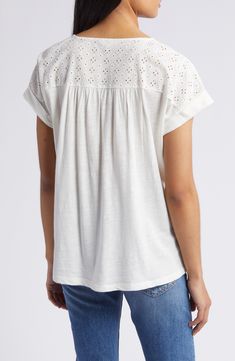 An airy openwork design tops this floaty top perfect for when the weather warms up. 24 1/2" length (size medium) Split neck Short sleeves 60% cotton, 40% modal with 100% cotton contrast Machine wash, tumble dry Imported Relaxed Fit V-neck Pointelle Knit Top, Casual V-neck Eyelet Blouse, Eyelet Tops With Relaxed Fit For Daywear, V-neck Pointelle Knit Top For Day Out, Relaxed Fit Eyelet Tops For Daywear, Cotton Eyelet V-neck Top, Spring V-neck Tops With Broderie Anglaise, Casual Airy Tops For Summer, Breezy Short Sleeve Cotton Blouse