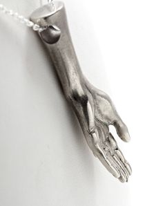 This elegantly detailed hand was designed , carved , cast and finished here in NYC. The hand is 1 3/4 inches long. It is cast in solid sterling silver and comes on your choice of silver chain lengths. This piece can be worn with the palm facing out to denote openness or palm down for protection. It may also be worn as a mourning piece palm down. You might notice the ring on the hand. I can set a little ruby,emerald, amethyst or what have you in that for $30. A diamond for $45. Just send me a con Carved White Gold Sterling Silver Jewelry, Antique Silver Hand Cast Pendant Jewelry, Hand Cast Antique Silver Pendant Jewelry, Hand-cast Antique Silver Pendant Jewelry, Hand Cast Antique Silver Metal Jewelry, Carved Sterling Silver Pendant Jewelry, Sterling Silver Carved Pendant Jewelry, Unique Hand Cast Silver Jewelry, Unique Hand Cast Silver Necklace