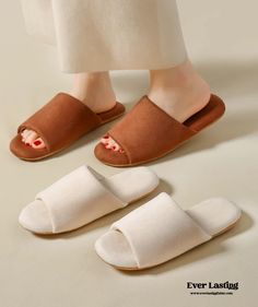 a woman's feet wearing slippers and sandals