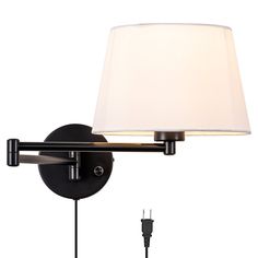 a wall light with a white shade on it and a plugged in charger