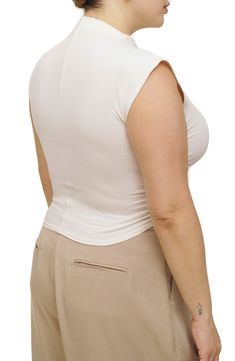 Stretch-hinted organic cotton offers exceptional comfort in this ruched crop top with an elegant mock neckline. 19" length (size Medium) Mock neck Sleeveless 88% organic cotton, 12% spandex Machine wash, tumble dry Imported Fitted Beige Tops With Built-in Bra, White Ruched Fitted Crop Top, Fitted Ruched Elastane Crop Top, White Ruched Stretch Crop Top, Fitted Beige Ruched Top, Fitted Cropped Ruched Tops, Cropped Fitted Ruched Top, Beige Ruched Stretch Top, White Ruched Cropped Top