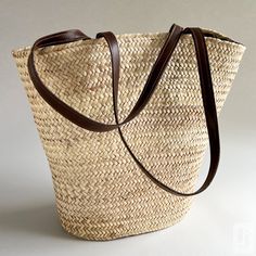 Embrace the warmth and vibrancy of the Mediterranean lifestyle with our stunning Large Woven Koffa from Tunisia. Handcrafted with the utmost care and attention to detail, this artisanal straw bag boasts a functional and beautiful design that is sure to capture your heart. The intricate straw weave evokes the rich cultural heritage and traditional style of the Mediterranean region. The sturdy leather straps provide both comfort and durability, making it easy to carry all your essentials, from fre Mediterranean Lifestyle, Brown Leather Strap, Fresh Produce, Cultural Heritage, The Mediterranean, Tunisia, Green Leather, Traditional Style, Red Leather