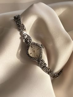 Rare Vintage 1940s Art Deco Ornate Dainty Solid 925 Silver Wind Up Ladies Cocktail Marcasite Encrusted Bracelet Wristwatch By Accurist.   This is a very beautiful item in remarkable condition considering it's vintage age. Marcasite stones all the way around the bezel and the strap. very sparkly!   The face is a beige colour and is clean and tarnish free, The face features classy minimalist raised gold plated hour markers on a rectangular bezel encrusted with marcasite stones all the way round.  (none missing) . This watch catches the light beautifully and gleams, glistens and sparkles! Truly a stunning, rare and ornate piece. A very elegant, classy, wristwatch, that has been well looked after  Inner diameter/wrist size : 20cm-21cm ladder clasp adjustable . clasp is set by so has some extra Vintage Watches Women Silver, Watches Women Classy, Vintage Silver Watch, Vintage Wrist Watch, 1940s Art Deco, 1940s Art, Classy Minimalist, Art Deco Watch, Silver Watches Women