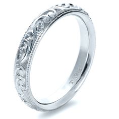 Platinum wedding band. Heirloom Round Band With Intricate Design, Heirloom Engraved Ring With Intricate Design, Elegant Engraved Ring With Decorative Band, Elegant Engraved Ring With Decorative Round Band, Elegant Wedding Jewelry With Milgrain Detail, Classic Engraved Ring With Intricate Design, Heirloom Engraved Promise Ring With Intricate Design, Intricate Engraved Promise Ring, Luxury Milgrain Wedding Jewelry