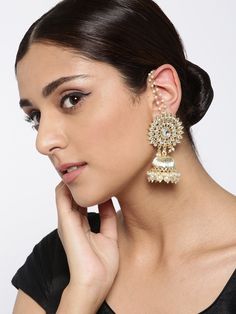 These gorgeous gold-toned dome-shaped jhumka earrings come with kundan stone studs, beads & ear-chain, are gold-plated and are secured with a post and back closure. These handcrafted jhumkas add just the right amount of elegance & oomph! to make those heads turn. The 'chain just nails it! Product color may vary based on the monitor or screen you are using.See FAQ for more details. Size Length: 7.5 cm Details Material: BrassStones: Kundan & BeadsPlating: Gold-plated Bollywood Brass Chandbali Jhumkas, Gold Plated Jhumkas With Latkans For Festivals, Bollywood Style Brass Chandbali Jhumkas, Gold Kundan Dangle Jhumkas, Gold Kundan Jhumkas Dangle Earrings, Gold-plated Meenakari Jhumkas In Dangle Style, Gold Plated Dangle Jhumkas With Latkans, Gold Plated Chandbali Danglers With Latkans, Gold Plated Jhumkas With Latkans