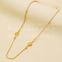 Adorn yourself with this elegant gold necklace, featuring a delicate chain and a stunning, handcrafted pendant. Its versatile design makes it a perfect accessory for both casual and formal looks, adding a subtle touch of glamour to your ensemble. yellow gold handmade chain jewelry from India. Brand- StarLikesGoldIndia Metal- yellow gold real gold. Metal purity- 18 Karat. Weight- 8.69 grams approx. Length - 18 inches approx Width-  1 and 8 millimeter, approx. Condition- excellent brand new Please Wedding Gold Chain Necklace, Gold Necklaces With Elegant Pendant Design, Gold Round Pendant With Simple Design, Elegant Gold-plated Gold Necklace, Elegant Gold Necklace With Delicate Chain, Elegant Yellow Gold Plated Necklaces, Delicate Gold Chain Necklace For Formal Occasions, Yellow Gold Chain Necklace For Wedding, Gold Chain Necklace With Simple Design For Gift