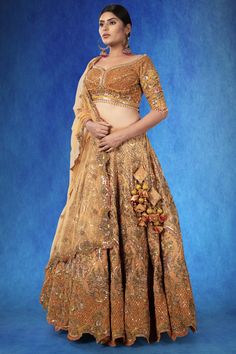 A beautiful rust-colored organza ensemble, adorned with intricate sequin threadwork, stonework, and cutdana. The exquisite craftsmanship is highlighted by the rich, textured fabric, making it a piece that stands out. WASH CARE INSTRUCTIONS - Please Dry clean only when it is applicable! Ready to Ship! Festive Designer Hand Embellished Choli, Hand Embellished Anarkali Raw Silk Set, Hand Embellished Kundan Sets For Reception, Gold Hand Embellished Traditional Wear For Reception, Embellished Gold Raw Silk Traditional Wear, Hand Embellished Organza Traditional Wear For Diwali, Kundan Hand Embellished Set For Reception, Hand Embellished Raw Silk Sets For Reception, Festive Hand Embellished Raw Silk Sets