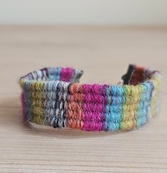 a close up of a colorful bracelet on a table