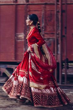 Royal Red Frock Pakistani Dress for Wedding has the perfect balance of tradition and elegance. This beautiful Pishwas Frock has premium cotton net fabric and is gracefully adorned with lavish details of Kundan, tilla, and Chatta Patti work, making this attire your foremost priority to have a classy look on the wedding. Frock: Pakistani Frock in the alluring red shade is a charismatic masterpiece to wear at the wedding. This beautiful frock is perfectly stitched and has a huge flare. This kalidaa Red Gown For Reception And Navratri, Red Gown For Navratri Reception, Red Cutdana Chanderi Dress, Red Gown For Reception At Navratri, Red Raw Silk Dress With Gota Work, Red Chanderi Dress With Cutdana Details, Red Gown With Pallu For Navratri, Red Cutdana Gown For Eid, Red Festive Gown With Sheer Dupatta