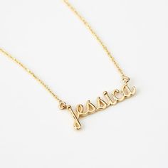 Script Name 14K Gold Necklace Adorn yourself with this 14K Gold Script Name Necklace, a perfect blend of personalization and style. Customizable for women, it's more than just a piece of jewelry; it's a statement of identity. This dainty 14k yellow gold necklace, makes an excellent personalized gift, elevating your elegance and charm. With its timeless design, it's a valuable addition to your jewelry collection, enhancing your style and personality. You'll have: 14k solid gold handcrafted neckla Elegant Customizable Gold Plated Name Necklace, Formal Yellow Gold Name Necklace With Initial Pendant, Formal 14k Gold Name Necklace With Initial Pendant, Elegant Customizable Gold Plated Necklaces, 14k Gold Initial Pendant Name Necklace For Formal Occasions, Elegant 14k Gold Custom Name Necklace, 14k Gold Custom Name Pendant Jewelry, Gold Fine Jewelry Custom Name Necklace, Custom Name 14k Gold Pendant Jewelry