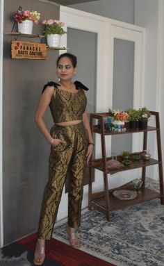 Attractive Banarasi Brocade Trouser with a Blouse Be the lively, beautiful you with an undying spirit as you wear this stylish Banarasi Brocade silk trouser set. This attire has a chic combination of trouser and a blouse with a printed panel detail, which is drool-worthy. Each piece of this outfit is crafted using the excellent quality of material that gives you a stylish and comfortable look. This attractive outfit will shower you compliments for your rich sense of style. This outfit is perfect Bollywood Style Silk Evening Sets, Elegant Raw Silk Sets For Navratri, Elegant Evening Sets For Diwali, Elegant Evening Sets For Festivals, Traditional Silk Sets For Evening, Traditional Silk Evening Sets, Silk Party Wear Sets For Festive Occasions, Elegant Raw Silk Party Sets, Silk Sets For Formal Festivals