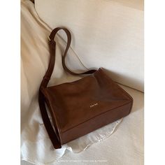 A crossbody bag with a retro design that has a moderately sized rectangular body that is easy to use on a daily basis. It has a distinctive shiny leather feel and has a pocket inside. The length of the shoulder strap can be adjusted. 
 
 
 Color 
 
 Dark brown 
 Black 
 
 
 Size 
 
 
 FREE size 
 
 Height: 22cm 
 Width: 31cm 
 Depth: 11.5cm 
 
 
 
 
 
 Material 
 
 Leather Retro Design, Inside Pocket, Dark Brown, Crossbody Bag, Easy To Use, Shoulder Strap, Leather, Black, Color