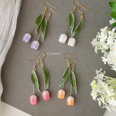 3D Tulip flower dangle earrings, Handmade shrink plastic tulip drop earrings, Pink Orange White purple tulips, Unique gift for her 🤍 Hypoallergenic 🌸 Handmade with love ✨ Cute & Dainty  🎁 Gift ready 〰️Click👇🏻 Find more Earrings🎀  https://www.etsy.com/shop/byYeeSo ◽️ PACKAGING ◽️  * The jewelry will be nicely packaged * Comes with a drawstring suede pouch * If you need personalized gift note, please click the link below, add it to your cart when check out to upgrade your packaging. https://www.etsy.com/listing/1008661207/upgrade-gift-packaging?ref=shop_home_active_1&frs=1 ◽️ SHIPPING ◽️ * USPS First Class Shipping Service with tracking number * All products will be shipped from USA ◽️ CARE INSTRUCTIONS ◽️ * Avoid perfumes or sprays * Avoid getting your jewelry wet * Wipe down the jewe Tulip Accessories, Dream Piercings, Tulip Earrings, Flower Dangle Earrings, Purple Tulips, Funky Earrings, Rose Orange, Tulip Flower, Clay Jewelry Diy