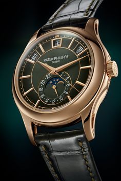 The Patek Philippe 5205 is an annual calendar wristwatch with 24-hour indicator and moonphase. The day, date and month are displayed through apertures in the upper half of the dial. Its design is reminiscent of the 5960 and other modern Patek Philippe watches. The 5205 is powered by caliber 324 S QA LU 24H/206. Dressed up as the 2022 reference 5205R-011, this watch has a Rose Gold case and a Green dial. Luxury Chronograph Rectangular Watch, Luxury Timeless Chronograph Watch With Subdials, Elegant Luxury Automatic Chronograph Watch, Luxury Classic Chronograph Watch For Formal Occasions, Luxury Classic Stainless Steel Watches, Luxury Men's Professional Watches, Luxury Automatic Watch Accessories With Rectangular Shape, Luxury Watch With Manual Winding And Rectangular Dial, Luxury Everyday Watch With Polished Finish