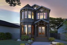 a large house with many windows and lights on it's front porch at dusk