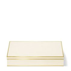 a white box with gold trim on the top and bottom, against a white background