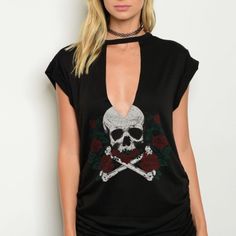 Short Sleeve Tee Is Black With White Skull And Cross Bones And Also Has Red Roses With Green Leaves. Back Is Blank. 86% Polyester 10% Rayon And 4% Spandex. Ruching Along Bottom Of Both Side Seams. Hand Wash Recommended. Edgy Skull Print Short Sleeve Top, Edgy Short Sleeve Top With Skull Print, Edgy Skull Print Crew Neck Top, Rebellious Black Crew Neck Top, Trendy Skull Shaped Tops For Fall, Skull Print Tops For Spring Streetwear, Casual Tops With Skull Shape For Alternative Fashion, Punk Black V-neck Top, Edgy Short Sleeve Halloween Tops