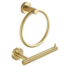 a gold colored towel ring and toilet paper holder with two brass - plated handles