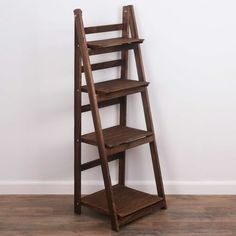 Milltown Merchants Distressed Ladder Shelf - Rustic Leaning Bookshelf - Brown: MILLTOWN MERCHANTS LADDER BOOKSHELF - The Milltown Merchants brown bookshelf comes with a unique rustic finish paired with a clean, modern silhouette. The carefully curated display is great for showcasing photo frames, succulents, art, small house plants, wicker baskets, and books. Create an eye catching display to compliment your unique space with the Milltown Merchants wooden bookshelf! FUNCTIONAL DESIGN - Tradition Sauder Bookcase, Succulents Art, Brown Bookshelves, Leaning Bookshelf, Farmhouse Bookshelf, Traditional Bookcases, Wooden Ladder Shelf, Leaning Bookcase, Rustic Bookshelf