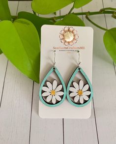 "These cute daisy earrings are hand-painted, sealed and have hypo-allergenic wires. Approximately 1.25\" long. Check out our website for more styles -  www.southerncraftersmb.com Message me with any questions, I'm happy to help!" Laser Cut Wood Earrings, Daisy Painting, Hand Painted Earrings, Painted Earrings, Daisy Earrings, Myrtle Beach Sc, Hand Painted Wood, Laser Cut Wood, Wood Earrings