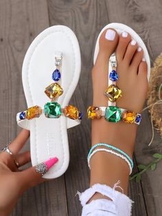 Add a touch of sparkle to your summer outfit with these stunning Radiant Rhinestone Party Sandals. Featuring colorful embellishments, these sandals are perfect for any party or event. Stay comfortable and fashionable all night long! Color : Multicolor Style : Glamorous Pattern Type : Plain Toe : Open Toe Details : Rhinestone Size Fit : True To Size Upper Material : PU Leather Lining Material : PU Leather Insole Material : PU Leather Outsole Material : Rubber Trendy Wedding Sandals For Summer, Trendy Summer Wedding Sandals, Bedazzled Sandals For Spring Party, Embellished Crystal Open Toe Sandals, Elegant Jeweled Sandals For Summer, Elegant Jeweled Summer Sandals, Embellished Toe Post Sandals For Party, Bedazzled Open Toe Sandals For Party, Summer Crystal Sandals With Rhinestones