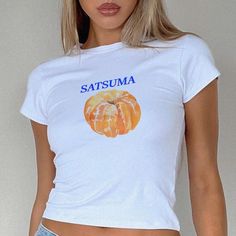 Satsuma 90s Baby Tee, T-shirt 90s Aesthetic Vintage Tee Trending Y2K Print Top * 90's Inspired baby tee style (made for adults) * 100% cotton * Easy tear-away label * Y2K Vintage Streetwear Trending Fashion * Environmentally sustainable made-to-order system The '90s-inspired baby features a soft, stretchy fabric, offering a snug, comfortable, and figure-flattering fit. Featuring a vibrant graphic print, this baby tee embodies the playful and youthful style of the 90's and Y2K eras. Ideal for pai Y2k Graphic Design T-shirt For Summer, Y2k Summer T-shirt With Graphic Design, Y2k Style Graphic T-shirt For Spring, Spring Y2k T-shirt With Graphic Design, Spring Y2k Style Graphic T-shirt, Spring Y2k Graphic T-shirt, Spring Y2k Graphic Design T-shirt, Y2k Letter Print Tops For Streetwear, Y2k Style Letter Print Tops For Streetwear