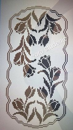 a cross stitch pattern with flowers on it