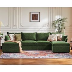 This 130.5-inch wide green sectional sofa combines a solid wood frame with luxurious chenille upholstery, bringing both modern style and functionality to your home. Designed as a modular sectional, it comfortably seats 6-8 people with medium-firm foam cushions supported by sinuous springs for lasting comfort. The fully movable ottomans provide ample storage space and allow you to configure the sofa as a sectional couch in either a U-shaped Section or L-shaped couch layout, adapting perfectly to your space. Foam-filled back cushions with removable covers make maintenance easy, and the armrests come with two accent pillows for added comfort and style. Whether for entertaining or relaxing, this green sectional is a versatile and stylish choice for any home. Latitude Run® Body Fabric: Green Ch Green Sectional Sofa, Couch Layout, Velvet Green Couch, Modular Sofa Living Room, 6 Seater Sofa, Green Velvet Sofa Living Room, Modular Couches, Sectional Living Room Decor, Green Sectional