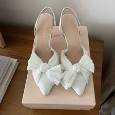 Loeffler Randall Sylvana Pearl White Heels - Perfect For Bride - Sold Out On Anthropologie Only Worn Once For My Rehearsal Size 9. A Voluminous Bow Detail Tops Off These Bridal Slingbacks With A Sleek, Pointed Silhouette. Slip-On Styling Polyester Upper; Leather Sole 3" Heel Imported Feminine Low Heel Slingback Pumps For Wedding, Elegant White Slingback Pumps With Bow, Chic Bow Slingback Pumps For Wedding, Elegant White Heels With 4-inch Heel, Elegant White 4-inch Heels, Chic White Slingback Pumps With Bow, Elegant Cream Heels With Bow, Elegant Wedding Shoes With Bow, White Open Heel Heels With Bow