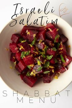 a white bowl filled with beets on top of a table